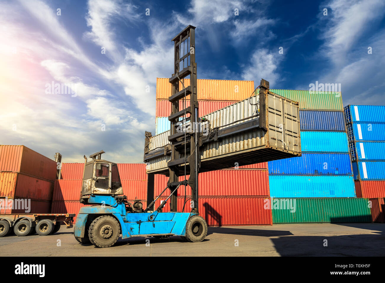 Forklift container loading and unloading cargo into the import-export zone Stock Photo