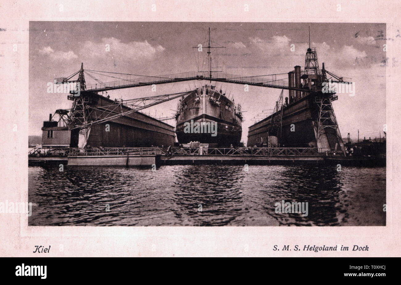 First World War / WWI, naval warfare, German dreadnought SMS 'Helgoland' in the dock after the Battle of Jutland, Imperial dockyard, picture postcard, postmarked 23.8.1916, naval battle, naval battles, battle, battles, Skagerrak, dockyard, dockyards, dry dock, dry docks, reparation, repair, ship of the line, warship, warships, navy, Imperial German Navy, German Empire, GER, WW1, 10s, 20th century, 1910s, world war, world wars, naval war, naval wars, dock, docks, picture postcard, picture postcards, historic, historical, Additional-Rights-Clearance-Info-Not-Available Stock Photo