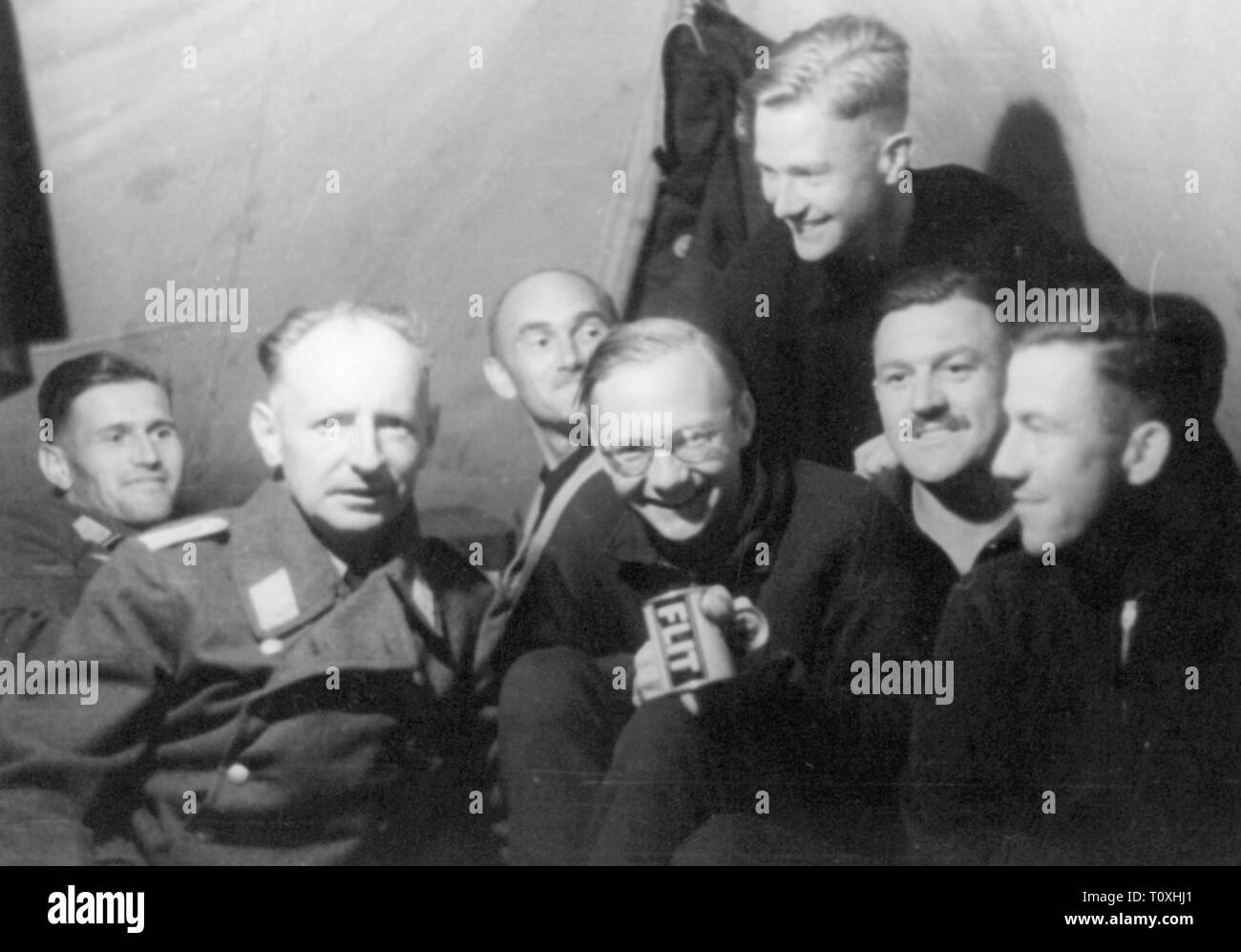 Second World War / WWII, Russia 1941, group of members of the 3rd Luftwaffe War Correspondent Company in camp, August 1941, Operation Barbarossa, eastern front, soldiers, soldier, tent, tents, cheerfulness, geniality, good mood, German Luftwaffe (German Air Force), war reporter, propaganda company, companies, propaganda corps, Wehrmacht, armed forces, people, 20th century, 1940s, second, 2nd, world war, world wars, group, groups, members, member, camp, camps, historic, historical, Additional-Rights-Clearance-Info-Not-Available Stock Photo