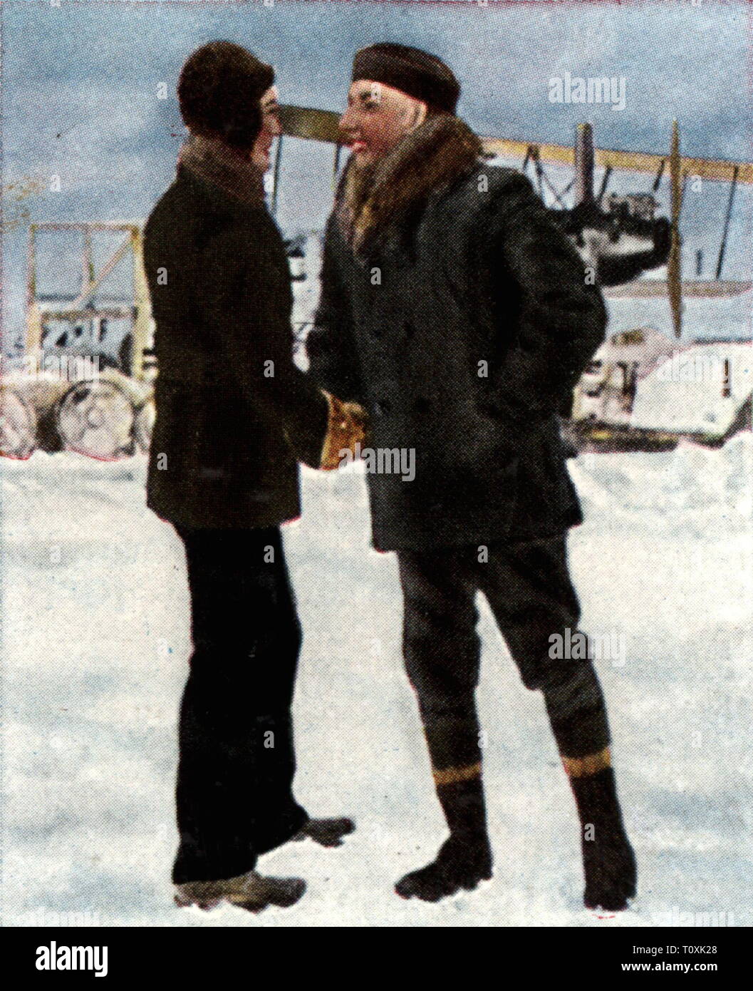 expedition, arctic, flights across the North Pole, the American Richard E. Byrd and the Norwegian Roald Amundsen are meeting each other, May 1926, coloured photograph, cigarette card, series 'Die Nachkriegszeit', 1935, flights, trans arctic flight, exploration, explorations, arctic explorer, USA, United States of America, Norway, men, man, people, 1920s, 20th century, expedition, expeditions, meeting, meetings, coloured, colored, post war period, post-war period, post-war years, post-war era, historic, historical, Additional-Rights-Clearance-Info-Not-Available Stock Photo