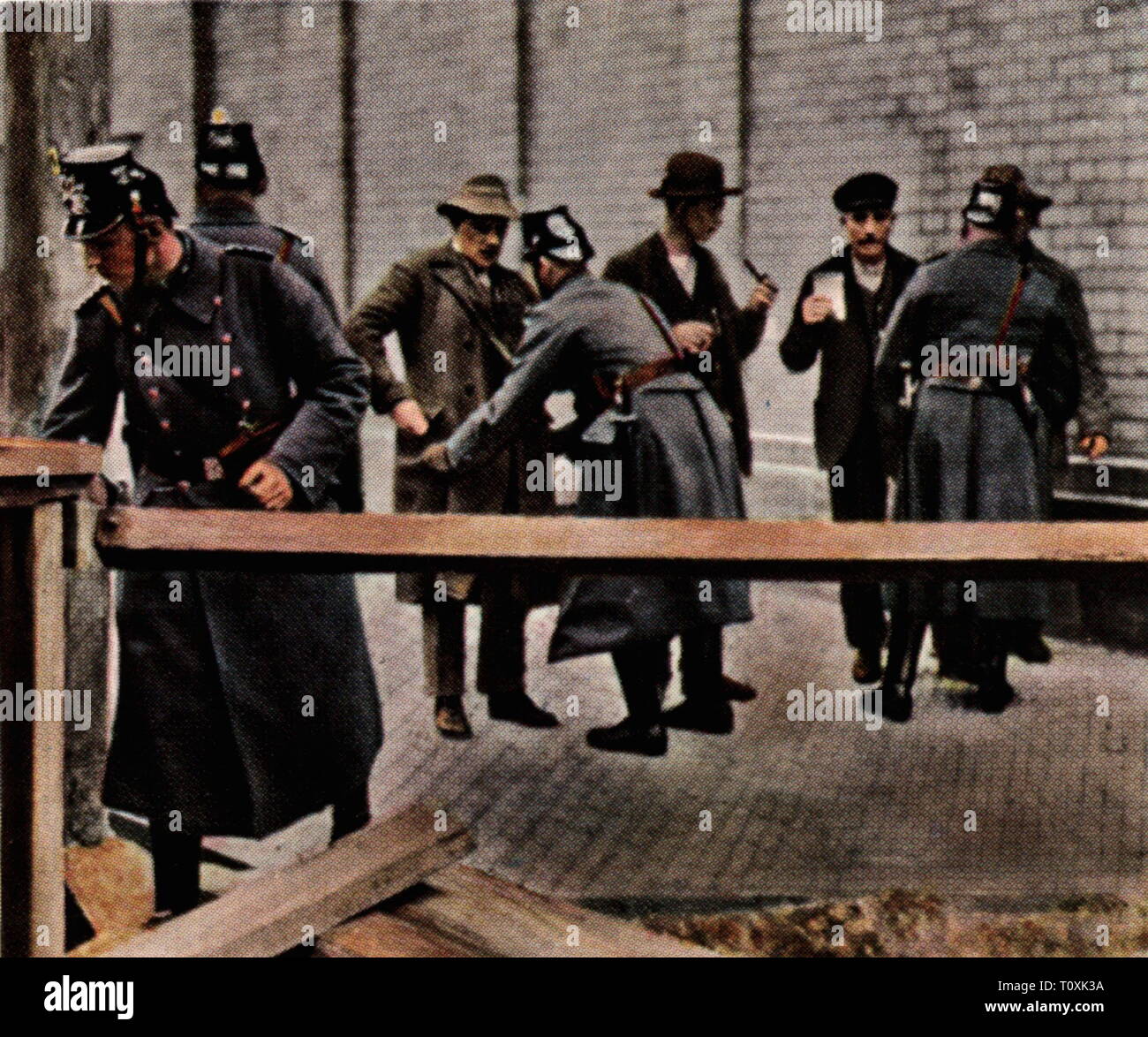 May Riots, 1.5. - 3.5.1929, road block of the police in Berlin-Neukoelln, coloured photograph, cigarette card, series 'Die Nachkriegszeit', 1935 blood May, May, riot, riots, politics, policy, protection police, frisk, frisking, search, searching, street, streets, blockade, Berlin, Neukölln, Free State of Prussia, Germany, German Reich, Third Reich, Weimar Republic, people, 1920s, 20th century, road block, roadblock, road blocks, roadblocks, coloured, colored, post war period, post-war period, post-war years, post-war era, historic, historical, Be, Additional-Rights-Clearance-Info-Not-Available Stock Photo