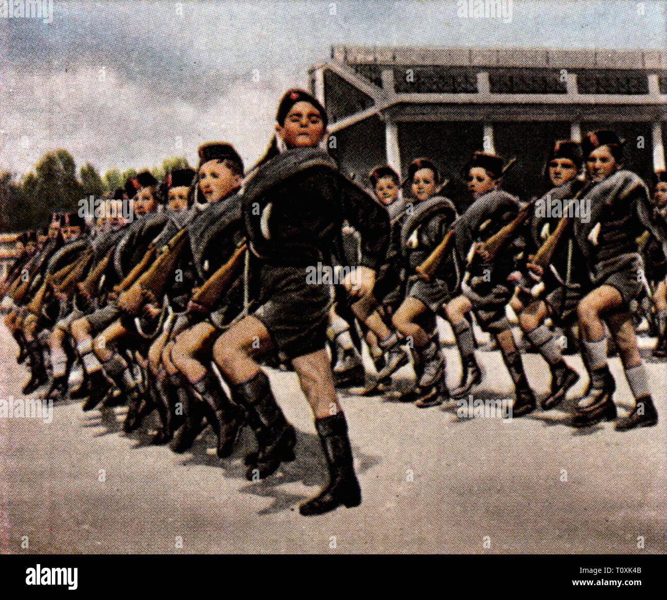 politics, fascism, Italy, party, youth organization Opera Nazionale Balilla, parade, 1931, coloured photograph, cigarette card, series 'Die Nachkriegszeit', 1935, national fascistic party, Partito Nazionale Fascista, PFN, party organization, party youth, youth, teenager, teen, teenagers, teens, children, child, kids, kid, march, marching, uniform, uniforms, uniformed, marching in step, in lockstep, march in step, dictatorship, dictatorships, Kingdom of Italy, people, 20th century, 1930s, politics, policy, youth organization, youth organizations, , Additional-Rights-Clearance-Info-Not-Available Stock Photo