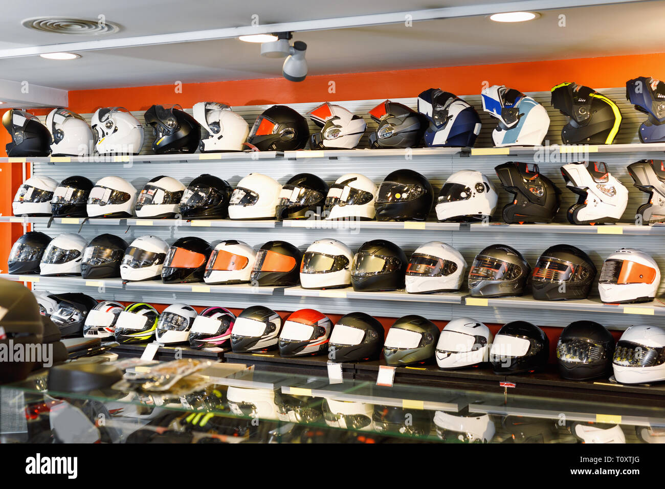 Interior Of Fashionable Moto Salon With Colorful Motorcycle Helmets On Shelves Stock Photo Alamy
