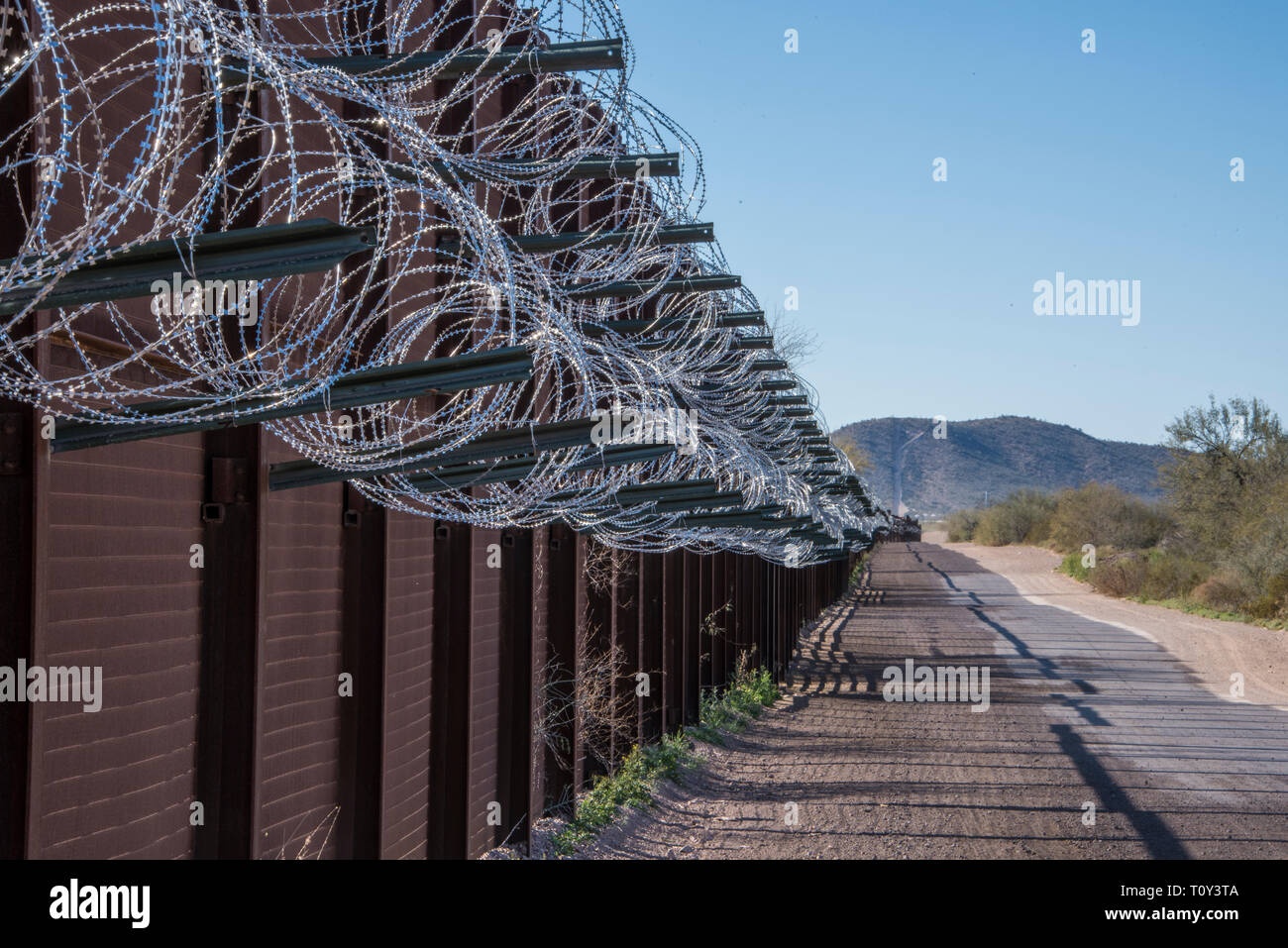 Border Fence with Razor Wire along the International Border between