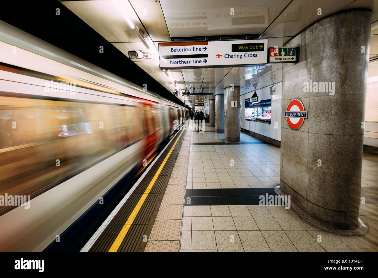 LONDON - MARCH 20, 2019: Train arriving at Embankment at Westminster tube station in London Stock Photo