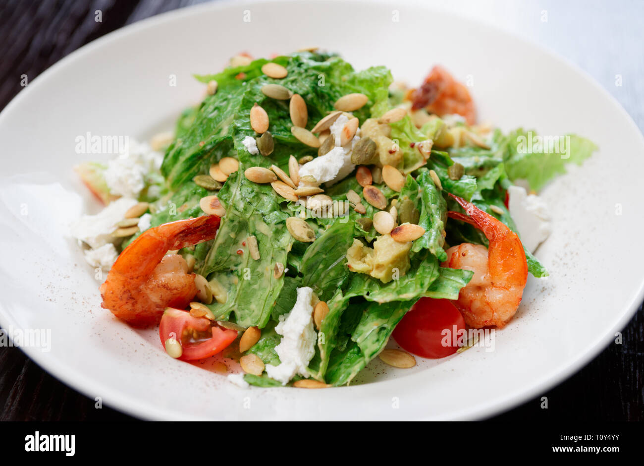 Caesar salad with prawns and goat cheese Stock Photo Alamy