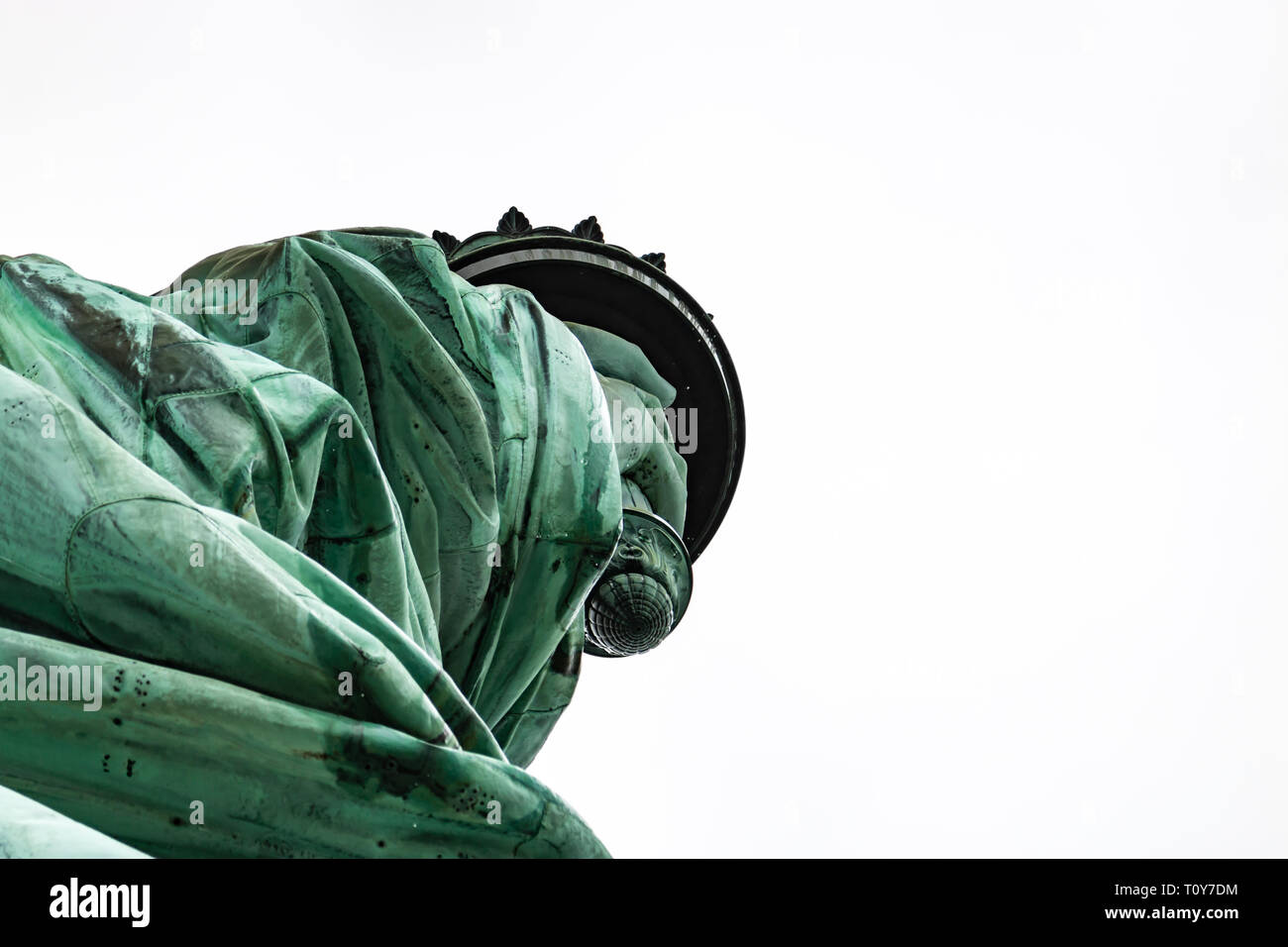 a close up of a rainwet Statue of Liberty focussing on her arm and