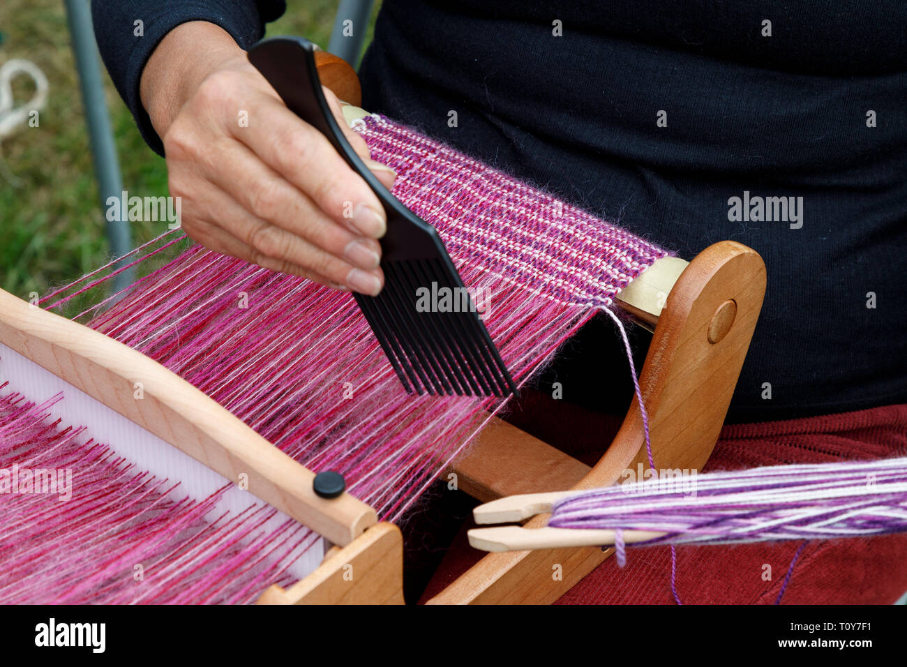 Demonstration of weaving on a handloom at the 2018 Aylsham Agricultural Show, Norfolk, UK. Stock Photo