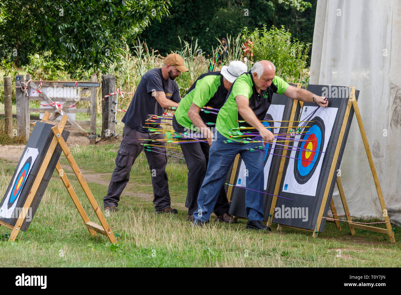 Archers retrieving arrows from the targets at the 2018 Aylsham Agricultural Show, Norfolk, UK. Stock Photo