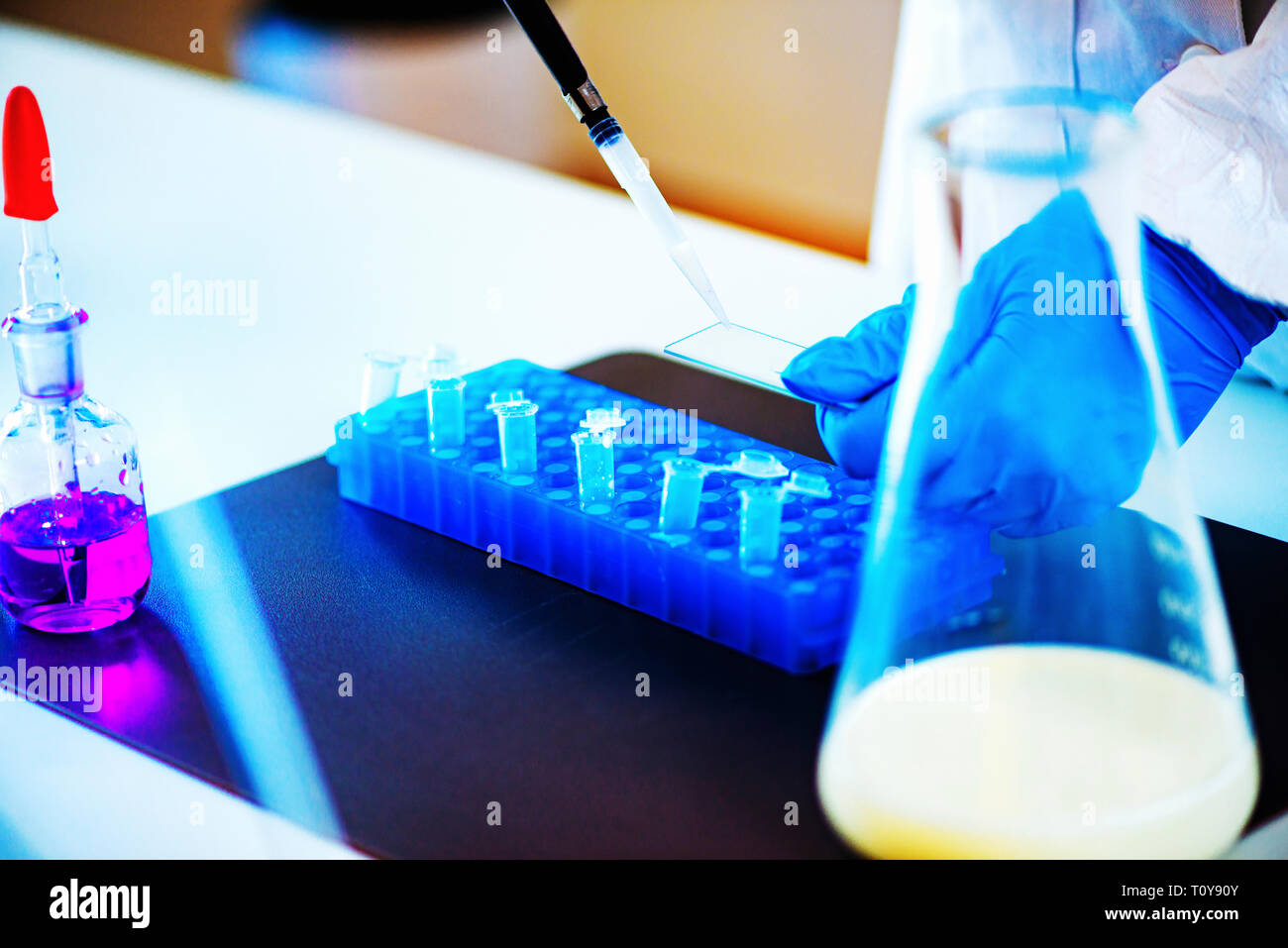 Quality control expert inspecting milk in the laboratory Stock Photo ...