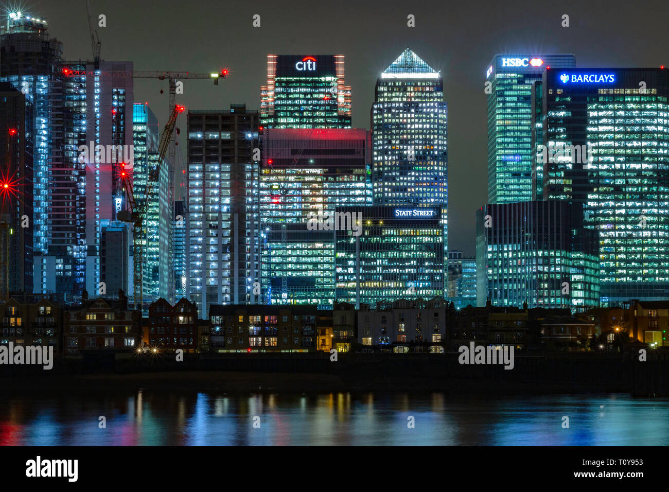 Canary Wharf, London, England, March 21 2019. A night shot of the 'square mile' financial district of the city across the river Thames with buildings Stock Photo