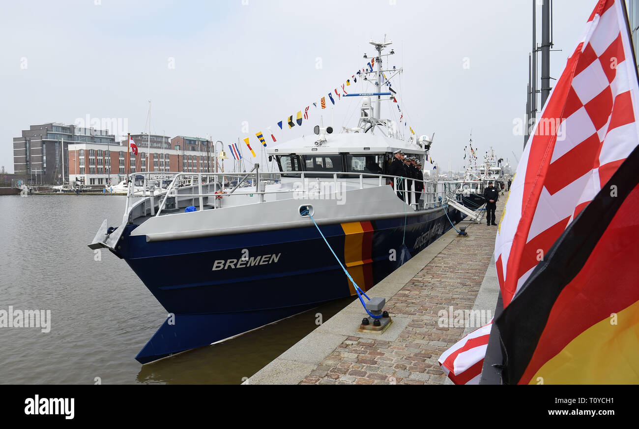 22 March 2019, Bremen, Bremerhaven: The German flag and the flag of Bremen are waving at the quay before the christening of the new customs boat 'Bremen'. The 24 meter long boat is to be used on the Outer Weser and in the North Sea in the future. Photo: Carmen Jaspersen/dpa Stock Photo