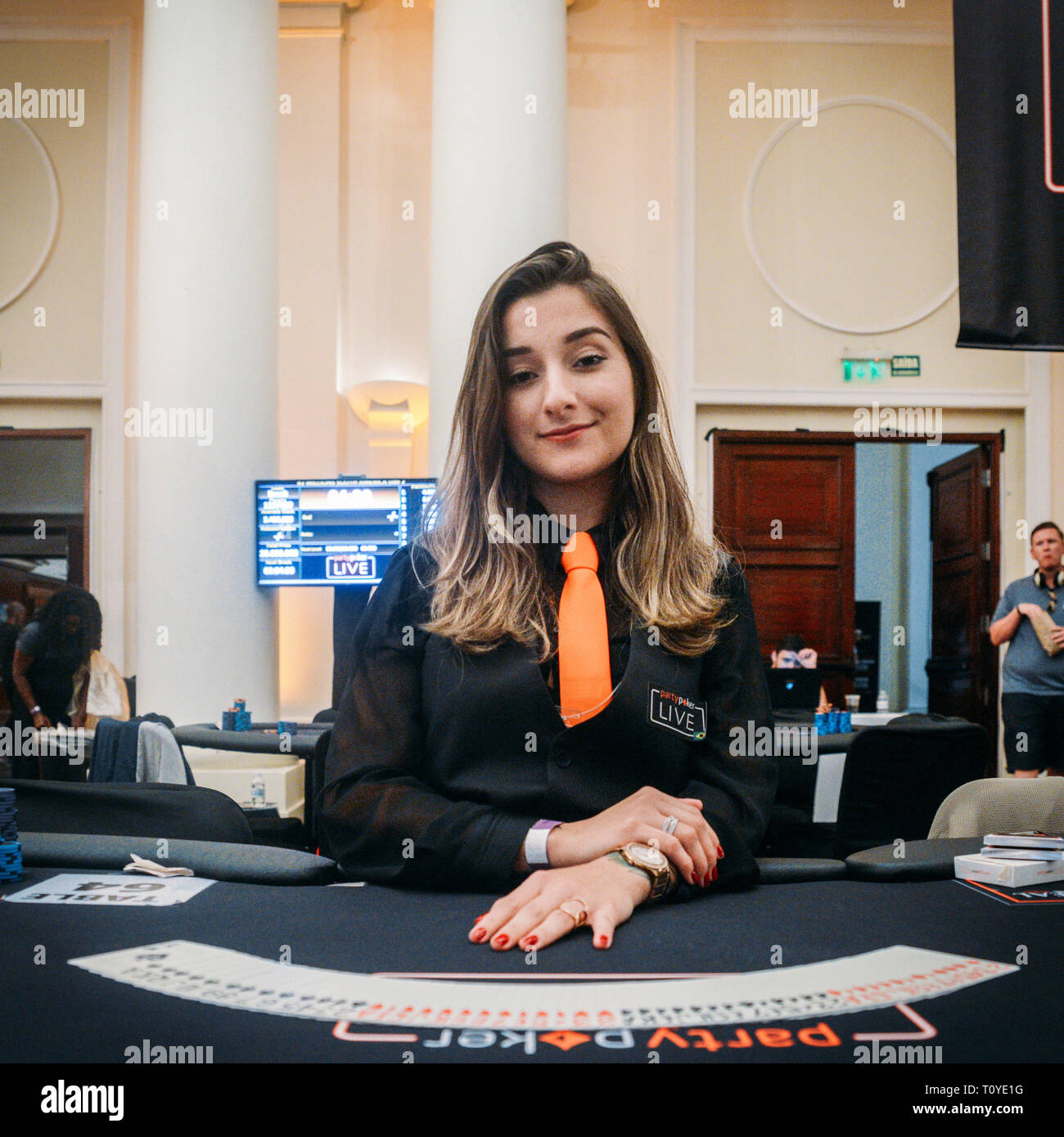 Rio de Janeiro, Brazil - March 21st, 2019: Close up of poker dealer at the the Main Event of the PartyPoker LIVE MILLIONS South America 2019 occuring at the luxurious Copacabana Palace Belmond Hotel in Rio de Janeiro, Brazil from March 15th through March 24th, 2019. Credit: Alexandre Rotenberg/Alamy Live News Stock Photo