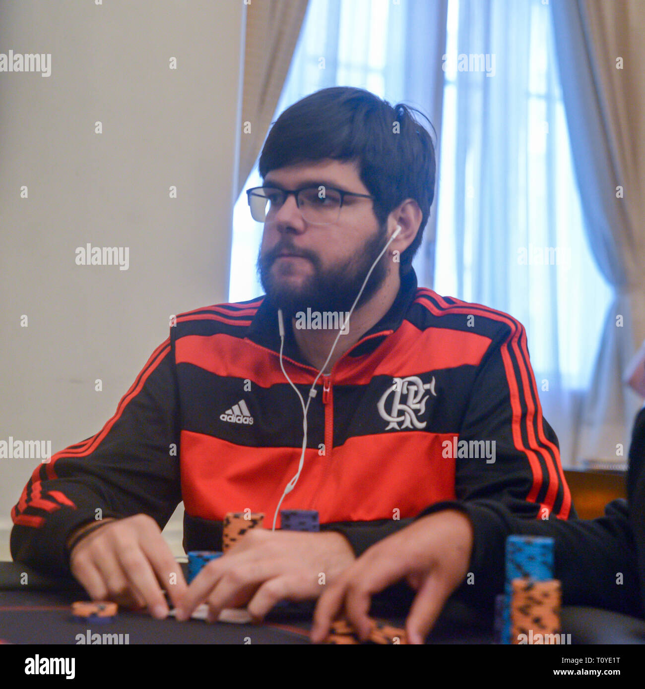 Rio de Janeiro, Brazil - March 21st, 2019: Poker Player wearing a flamengo jersey at the Main Event of the PartyPoker LIVE MILLIONS South America 2019 occuring at the luxurious Copacabana Palace Belmond Hotel in Rio de Janeiro, Brazil from March 15th through March 24th, 2019. Credit: Alexandre Rotenberg/Alamy Live News Stock Photo