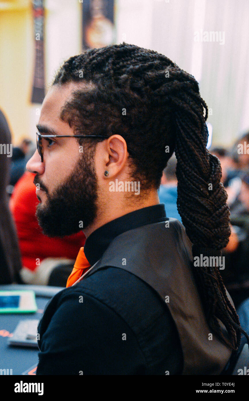 Rio de Janeiro, Brazil - March 21st, 2019: Close up of poker dealer with afro-hair at the the Main Event of the PartyPoker LIVE MILLIONS South America 2019 occuring at the luxurious Copacabana Palace Belmond Hotel in Rio de Janeiro, Brazil from March 15th through March 24th, 2019. Credit: Alexandre Rotenberg/Alamy Live News Stock Photo