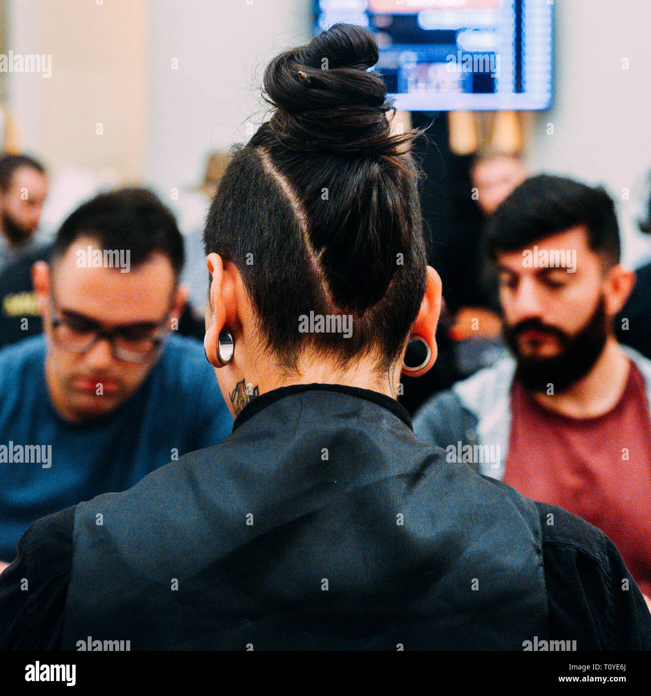 Rio de Janeiro, Brazil - March 21st, 2019: Close up of poker dealer with exotic eerings at the the Main Event of the PartyPoker LIVE MILLIONS South America 2019 occuring at the luxurious Copacabana Palace Belmond Hotel in Rio de Janeiro, Brazil from March 15th through March 24th, 2019. Credit: Alexandre Rotenberg/Alamy Live News Stock Photo