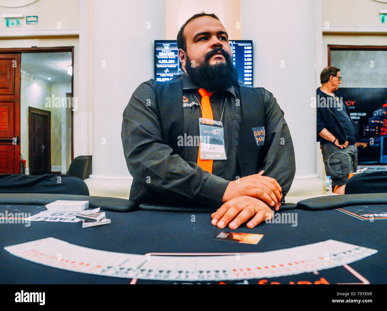 Rio de Janeiro, Brazil - March 21st, 2019: Close up of poker dealer at the the Main Event of the PartyPoker LIVE MILLIONS South America 2019 occuring at the luxurious Copacabana Palace Belmond Hotel in Rio de Janeiro, Brazil from March 15th through March 24th, 2019. Credit: Alexandre Rotenberg/Alamy Live News Stock Photo
