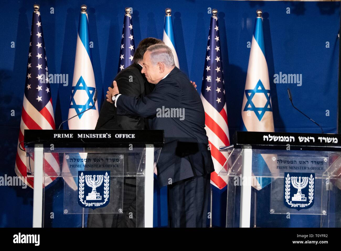 U.S. Secretary of State Mike Pompeo, left, is embraced by Israeli Prime Minister Benjamin Netanyahu during a joint press conference at the official residence March 21, 2019 in Jerusalem, Israel. Stock Photo