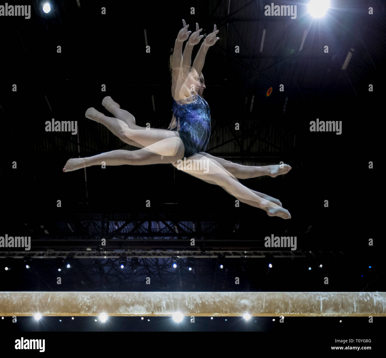 Resorts World Arena, Birmingham, UK. 22nd Mar, 2019. Gymnastics World Cup, previews; Multiple exposure in camera of Aliya Mustafina (RUS) on the Balance Beam during training at the 2019 Gymnastics World Cup Birmingham Credit: Action Plus Sports/Alamy Live News Stock Photo