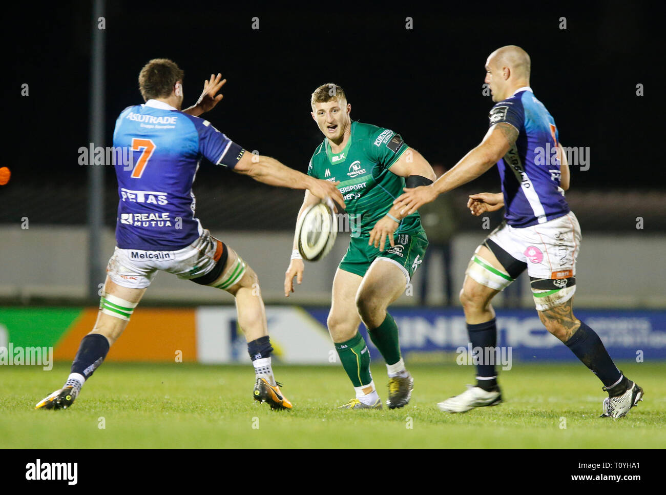 Galway Sports Ground, Galway, Ireland. 22nd Mar, 2019. Guinness Pro14  rugby, Connacht versus Benetton; Peter Robb (Connacht) plays the ball  between Giovanni Pettinelli and Marco Lazzaroni (Benetton) Credit: Action  Plus Sports/Alamy Live