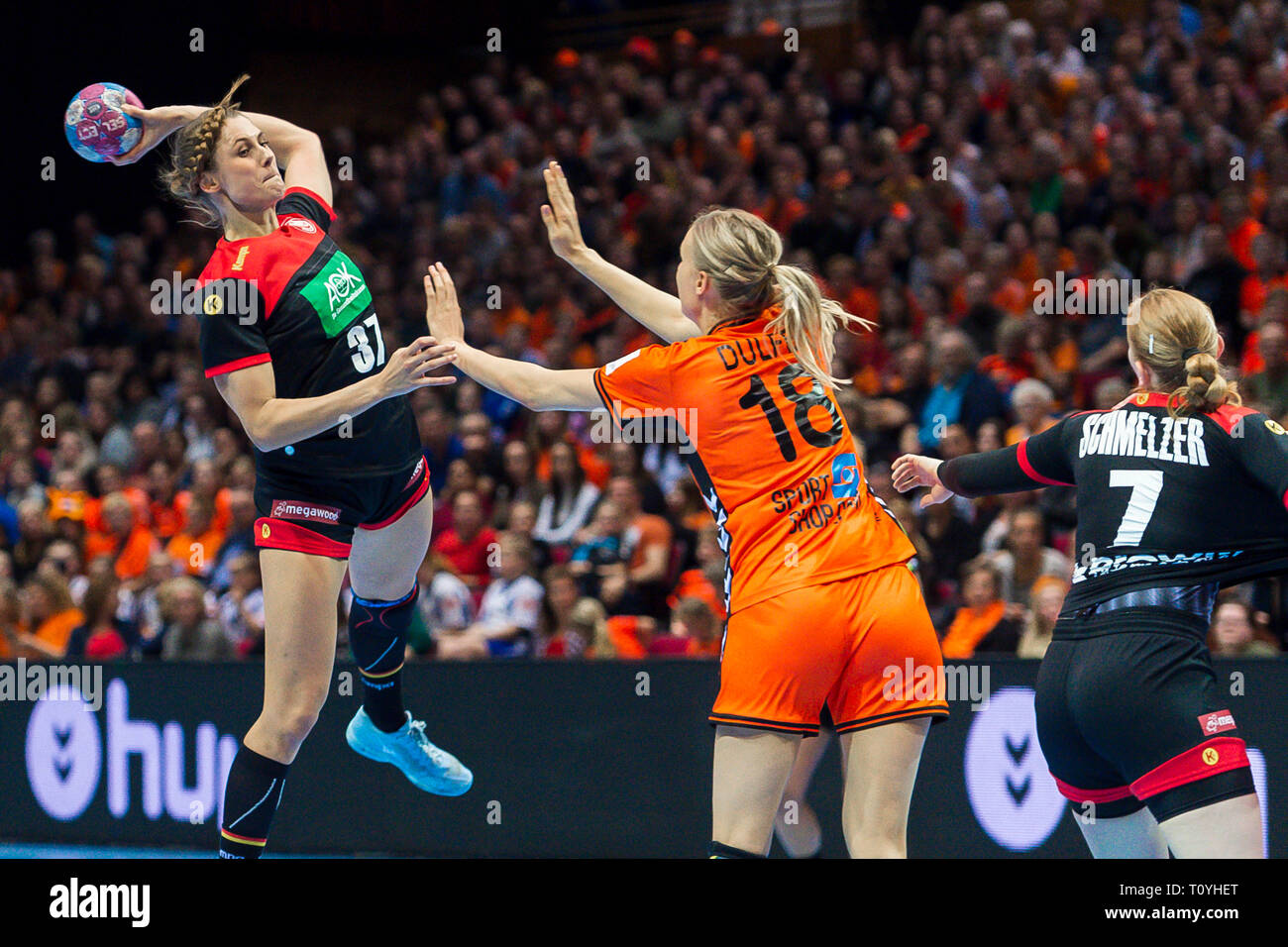 22 March 2019, Netherlands, Groningen: Handball, women: International, Netherlands - Germany: Alicia Stolle (l) and Meike Schmelzer (r) from Germany against Kelly Dulfer (M) from the Netherlands in action. Photo: Marco Wolf/wolf-sportfoto/dpa Stock Photo