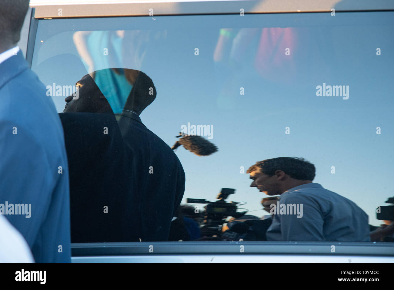 Charleston, SC, USA. 22nd Mar 2019. Democratic presidential hopeful Beto O’Rourke is reflected in the window of his van as he speaks with reporters during a campaign stop at Tradesman Brewing Company March 22, 2019 in Charleston, South Carolina. South Carolina, called the First in the South, is the first southern democratic primary in the presidential nomination race. Credit: Planetpix/Alamy Live News Stock Photo