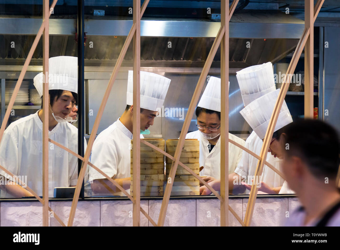 Chinese chefs working in restaurant kitchen, Hong Kong, SAR, China Stock Photo