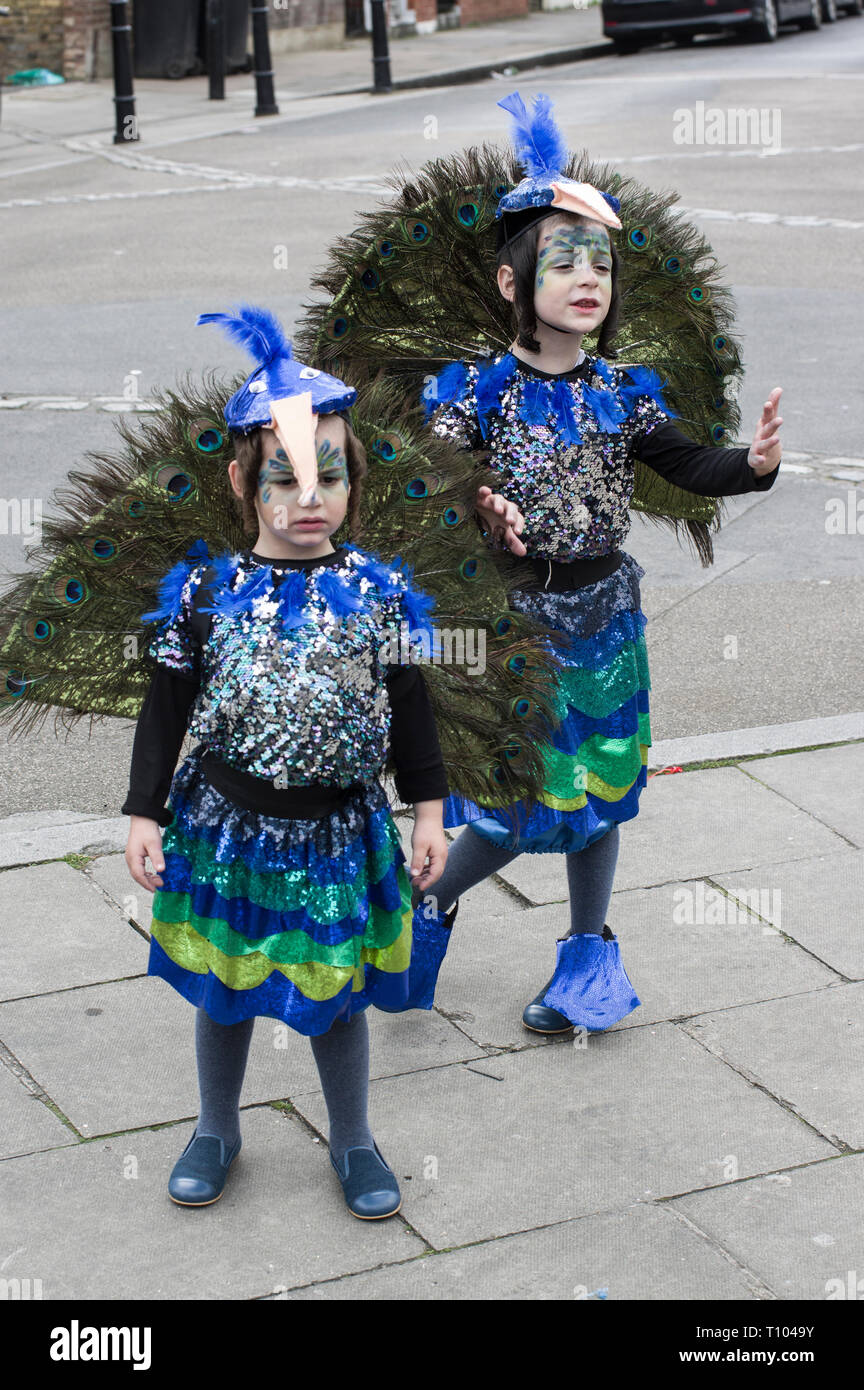 Two Hasidic Jewish children dressed in peacock costumes for Purim on 21 march 2019 in London celebrating Queen Esther preventing genocide of the Jews Stock Photo