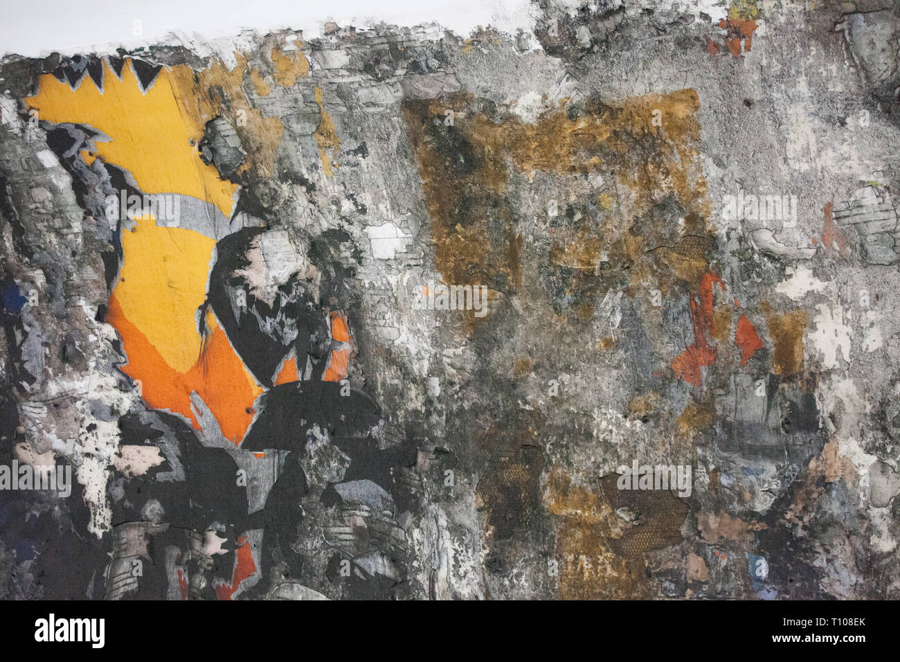 Abstract pattern caused by ripped advertising poster in Tube station