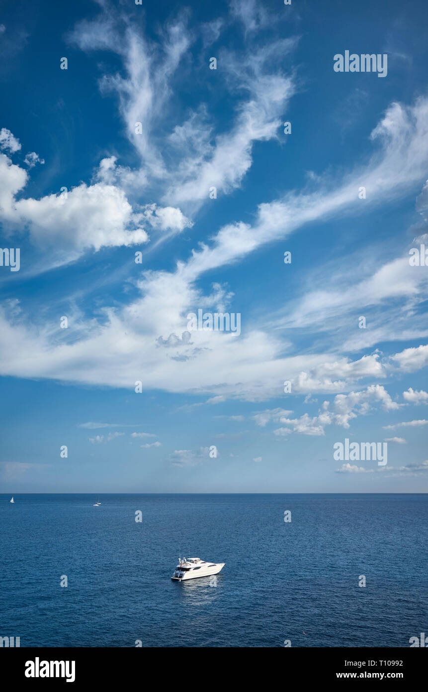 Scenic seascape with a lonely boat, travel concept. Stock Photo