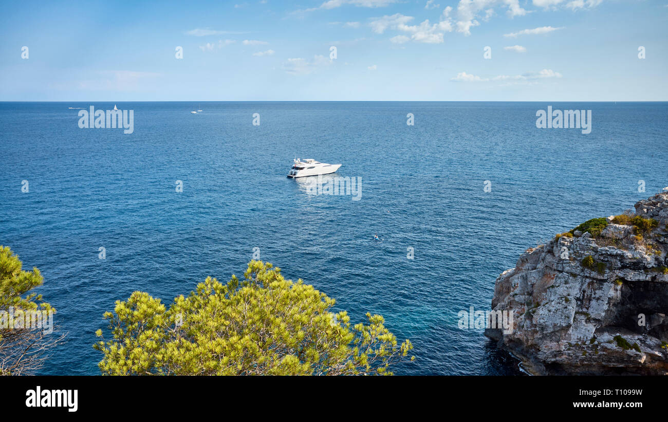Scenic seascape with a lonely boat, travel concept. Stock Photo