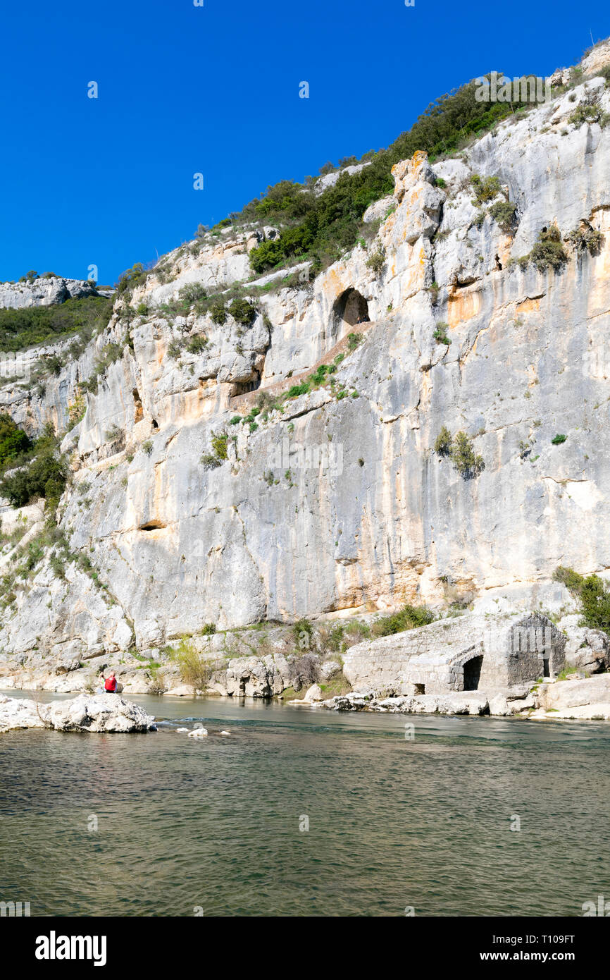Sanilhac-Sagries (south-eastern France): site of La Baume and Saint-Veredeme in the Gardon gorges, with a cave and troglodytic dwellings in the cliff Stock Photo