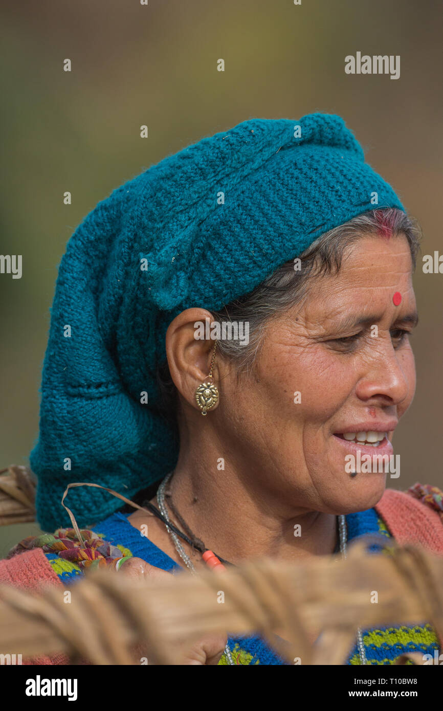 Woman wearing knitted wool headwear. Rudraprayag-Ukhimath, Chopta, Triyuginarayan area, Lower Himalayas, Northern India. Stock Photo