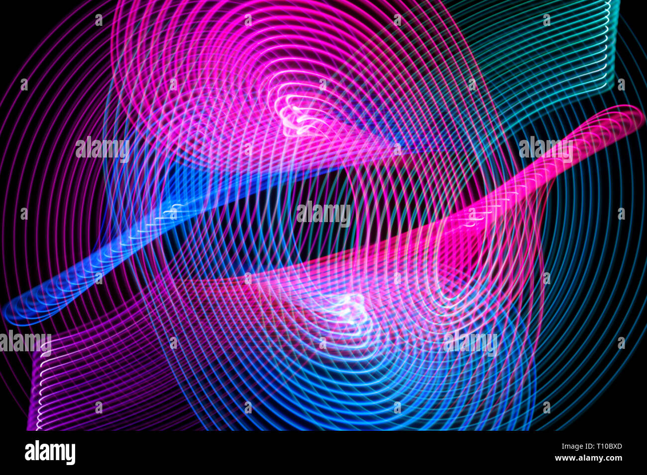 Abstract rainbow blue and pink neon glowing crossing lines pattern ...