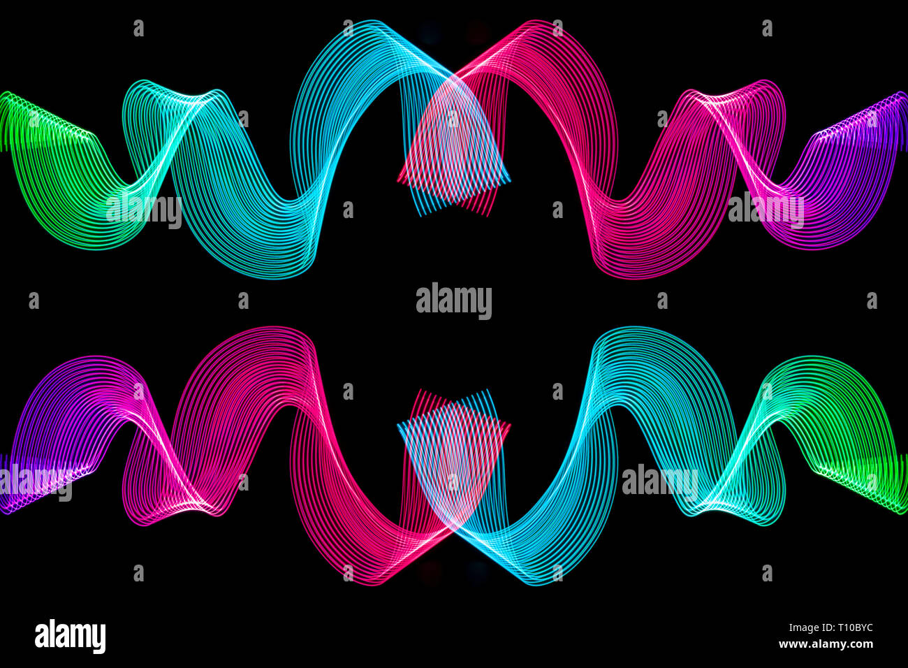 Colorful pink, green, red and pink neon spiral lines.Abstract