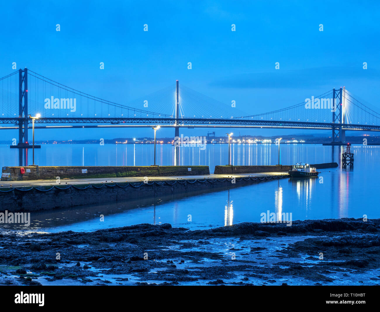 The Forth Road Bridge and Queensferry Crossing at dusk from South Queensferry City of Edinburgh Scotland Stock Photo