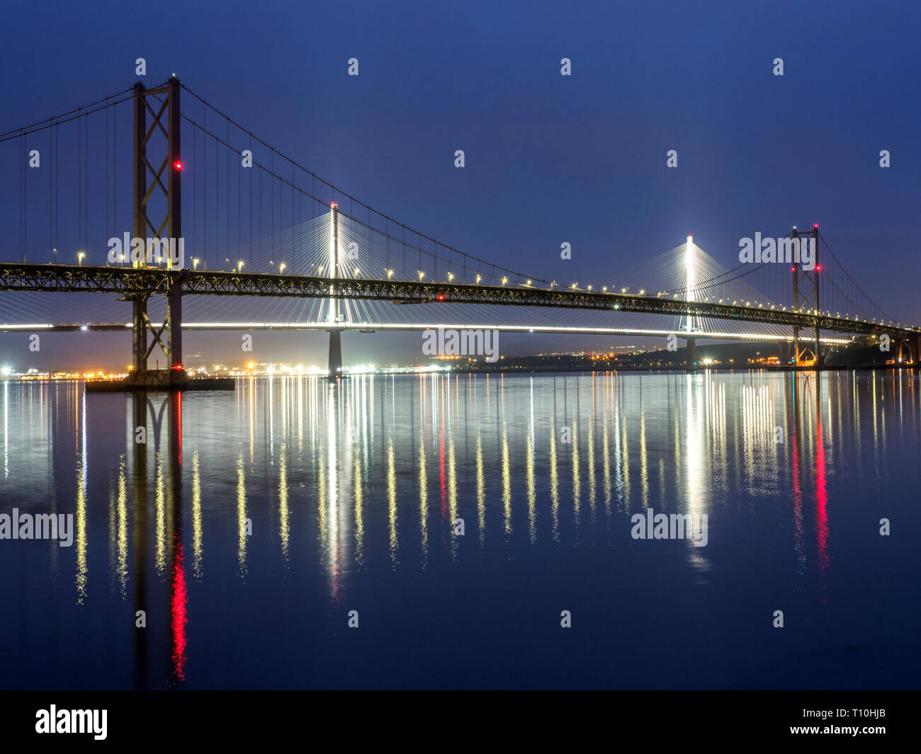 Queensferry Crossing and the Forth Road Bridge at dusk South Queensferry City of Edinburgh Scotland Stock Photo