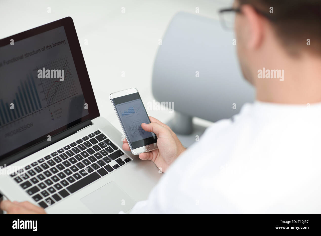 close up. businessman using gadgets to check financial data Stock Photo