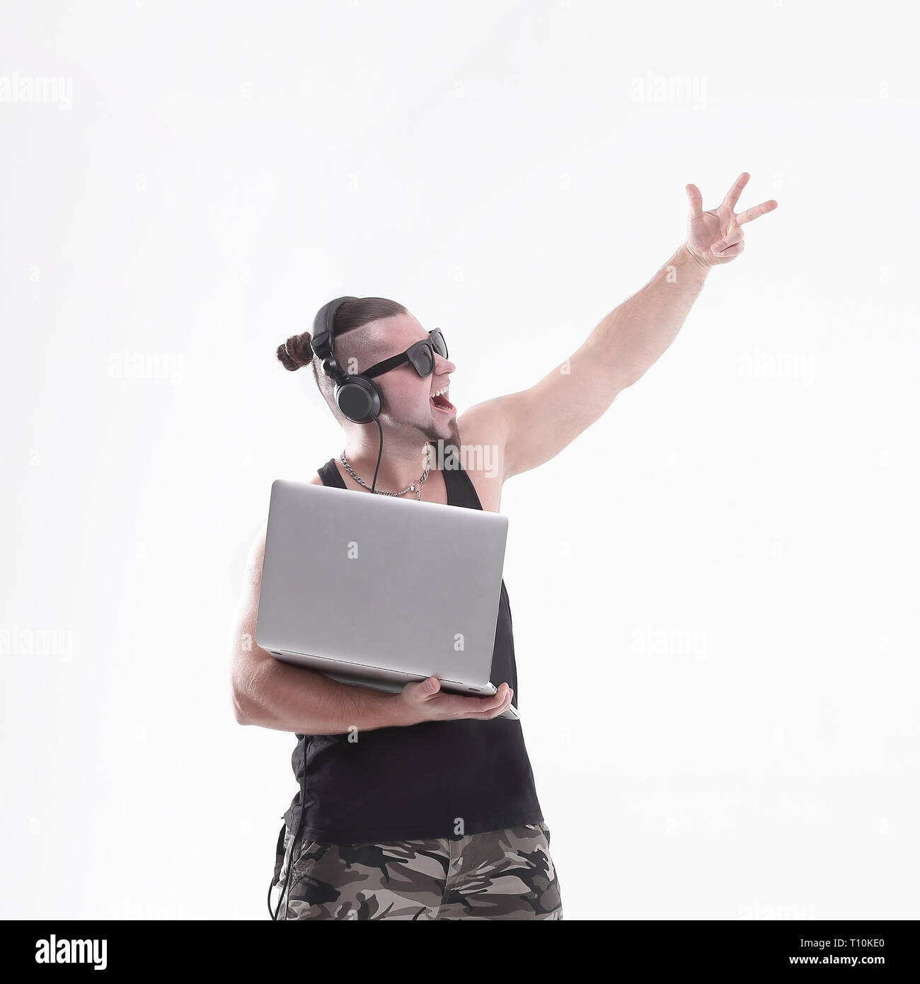 happy DJ-rapper with an open laptop .isolated white background Stock ...