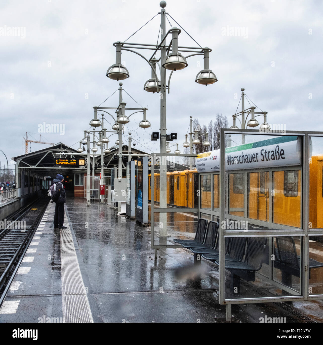Berlin, Friedrichshain. Warschauer Strasse U-Bahn railway station platform with brick signal box and decorative lamp posts. Stock Photo