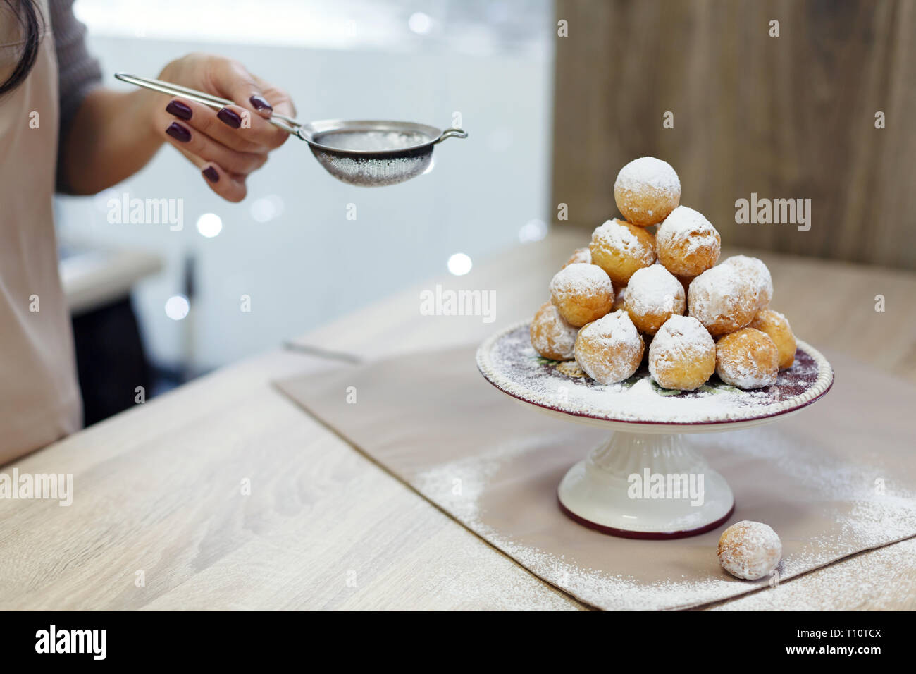 Donuts on a tray sprinkled with powdered sugar. Stock Photo
