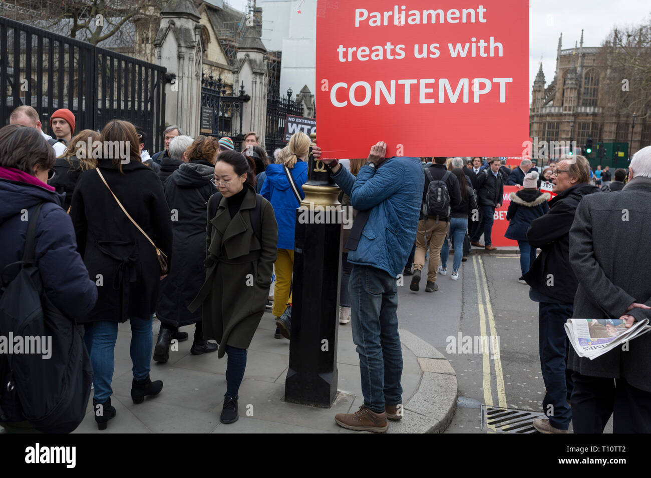 A day after Commons Speaker John Bercow announced his refusal to accept Prime Minster Theresa May's third Brexit Meaningful Vote, a Brexiteer holds a sign about parliament's contemptuous treatment of its people, on 19th March 2019, in London, England. Stock Photo