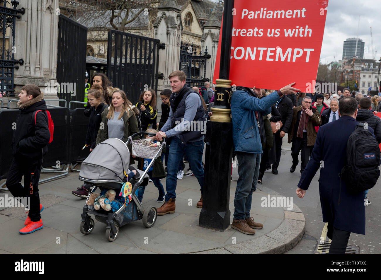 A day after Commons Speaker John Bercow announced his refusal to accept Prime Minster Theresa May's third Brexit Meaningful Vote, a Brexiteer holds a sign about parliament's contemptuous treatment of its people, on 19th March 2019, in London, England. Stock Photo
