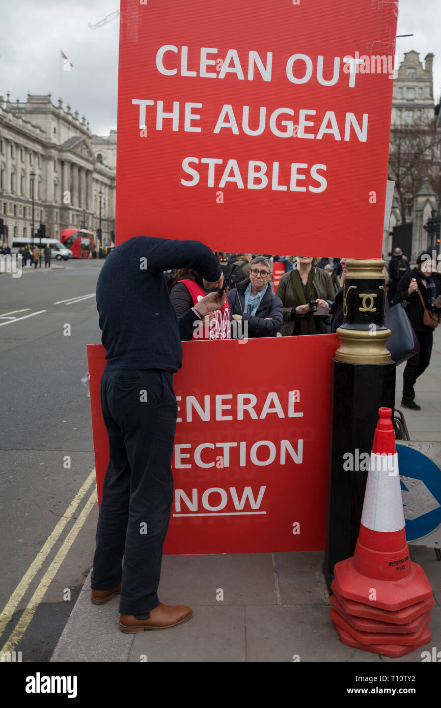A day after Commons Speaker John Bercow announced his refusal to accept Prime Minster Theresa May's third Brexit Meaningful Vote, a Brexiteer holds a sign that refers to the stables in which the mythical Argonaut King Augeas kept 3000 oxen, and which had not been cleaned for 30 years. The cleaning of these stables was accomplished by Hercules, on 19th March 2019, in London, England. Stock Photo
