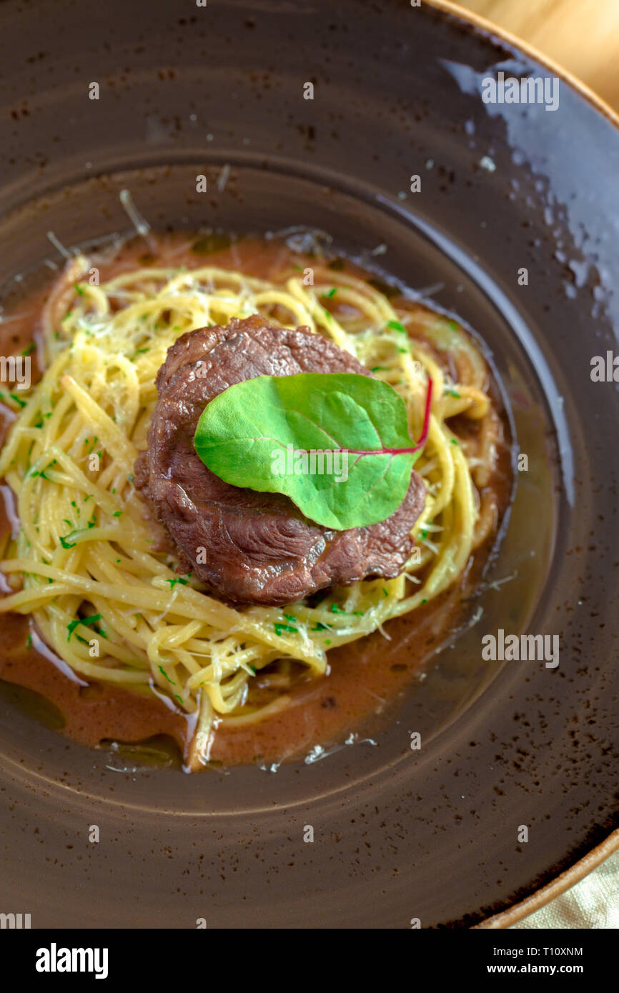 grilled beef fillet pieces on noodles Stock Photo Alamy