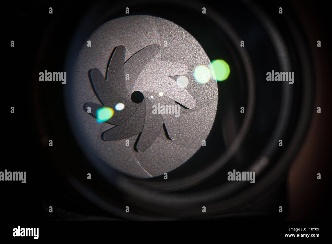 The diaphragm of a camera lens aperture. Selective focus with shallow ...