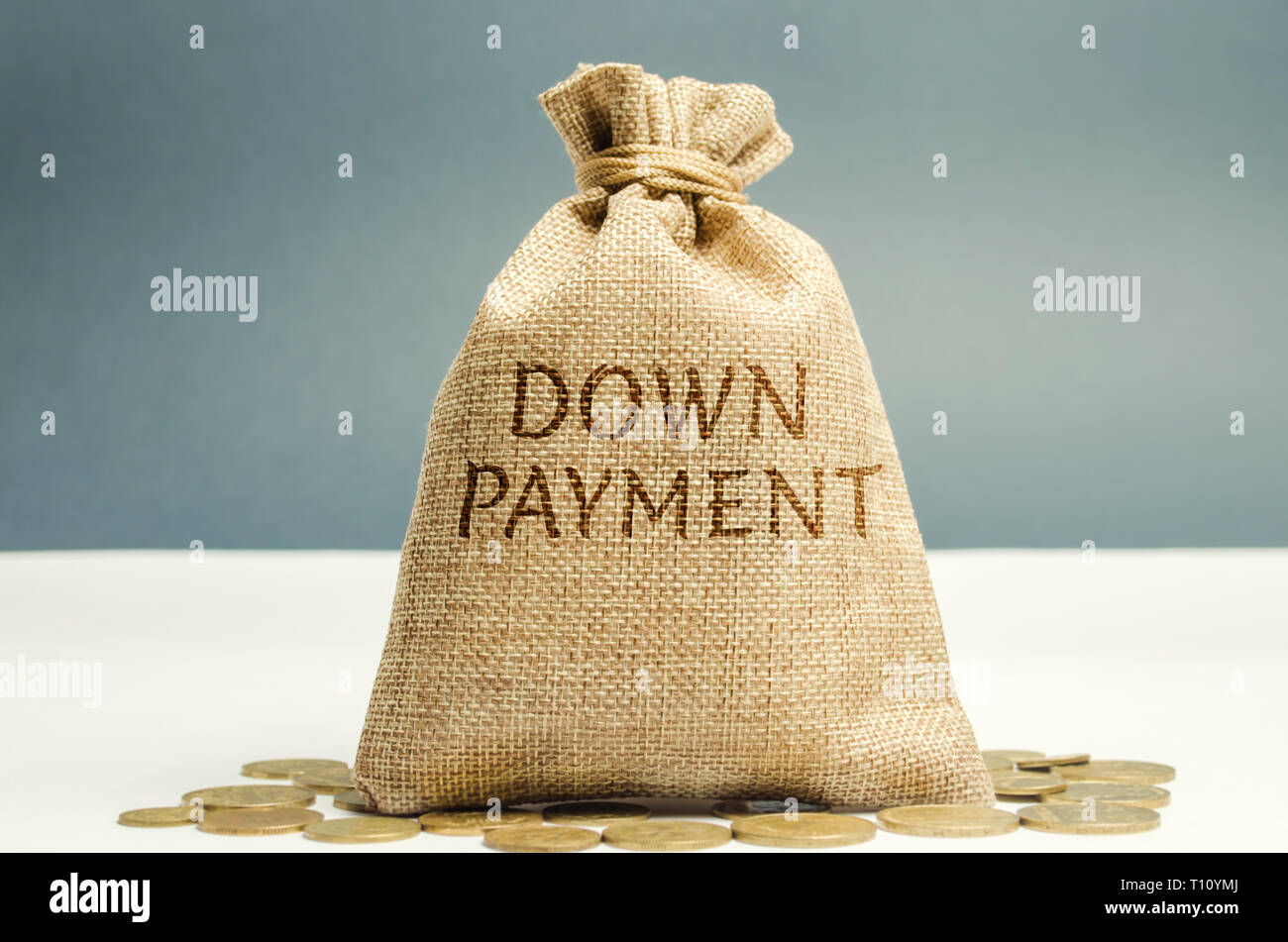 Money bag with the word down payment. Payment used in the context of the purchase of expensive items such as a car and a house, whereby the payment is Stock Photo