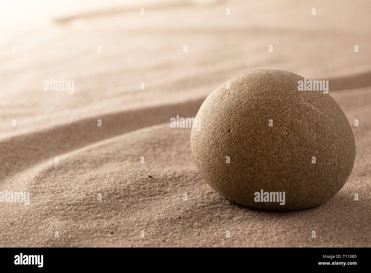 zen stone and sand garden. Concept for relaxation meditation purity spirituality and balance. Rock and lines spa wellness background Stock Photo