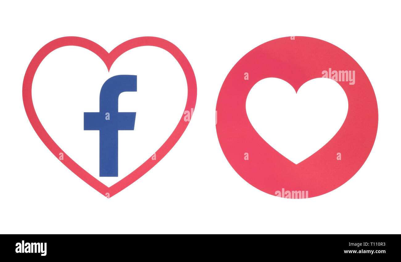 Kiev, Ukraine - November 28, 2018: Facebook heart icon with Love Empathetic Emoji Reaction printed on paper. Illustration of new Facebook feature Stock Photo