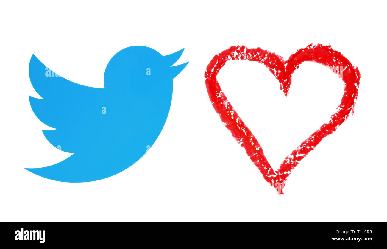 Kiev, Ukraine - December 19, 2018: Twitter bird with hand drawn red heart with oil pastel pencil. Twitter considers removing ‘Like’ button. Stock Photo